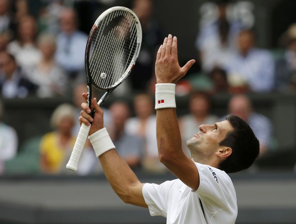Novak Djokovic of Serbia reacts during his mens singles final tennis match against Roger Federer of Switzerland at the Wimbledon Tennis Championships, in London July 6, 2014. 