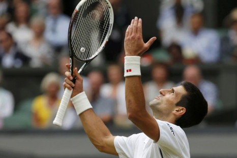 Novak Djokovic of Serbia reacts during his men's singles final tennis match against Roger Federer of Switzerland at the Wimbledon Tennis Championships, in London July 6, 2014. 