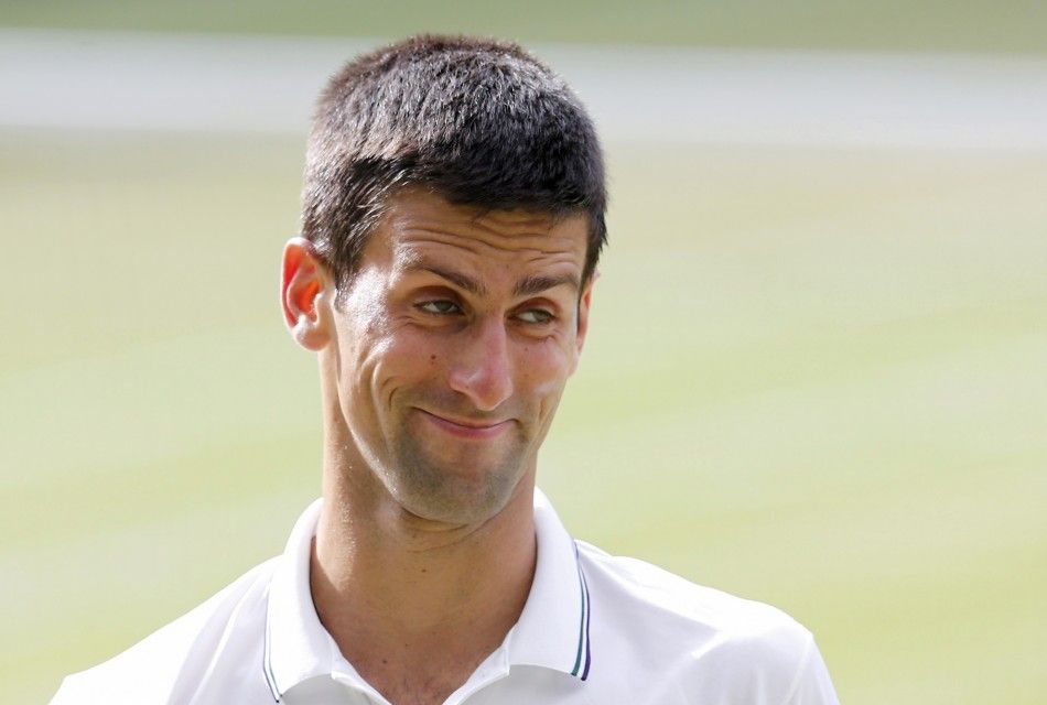 Novak Djokovic of Serbia reacts during his mens singles finals tennis match against Roger Federer of Switzerland on Centre Court at the Wimbledon Tennis Championships in London July 6, 2014. 