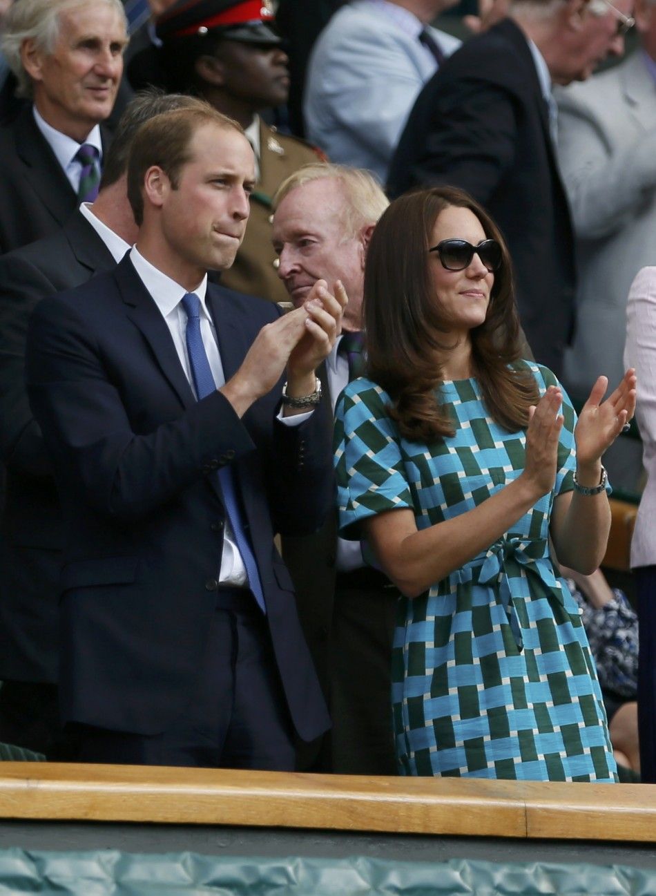 Britains Prince William and his wife Catherine, Duchess of Cambridge applaud after the fourth set of the mens singles final tennis match between Novak Djokovic of Serbia and Roger Federer of Switzerland on Centre Court at the Wimbledon Tennis Championsh