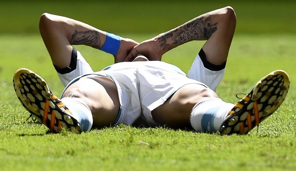 Argentinas Angel Di Maria lies on the pitch after an injury 