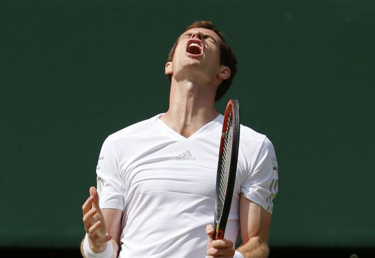 Andy Murray of Britain reacts during his men&#039;s singles quarter-final tennis match against Grigor Dimitrov of Bulgaria at the Wimbledon Tennis Championships, in London July 2, 2014.