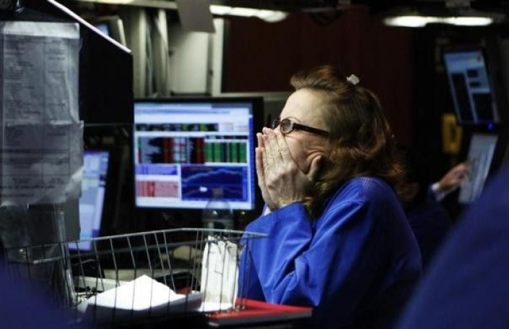 A trader watches a monitor displaying stocks on the floor of the New York Stock Exchange February 4, 2010.