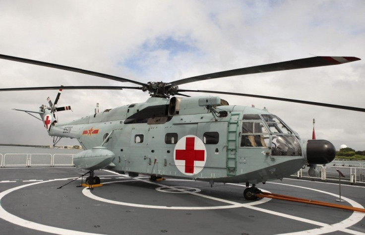 A Z-JH8 helicopter sits on the deck of the Chinese People Liberation Army Naval hospital ship Peace Ark at Joint Base Pearl Harbor Hickam in Honolulu, Hawaii, July 5, 2014.