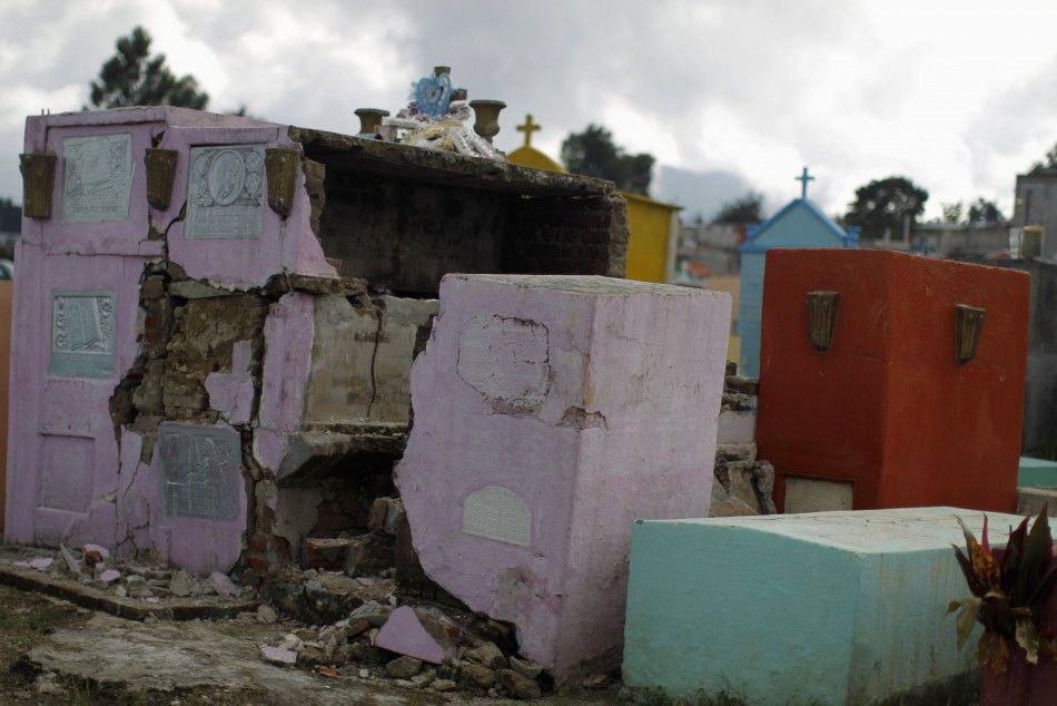 Tombs damaged by the earthquake are seen in the cemetery of San Marcos, in the San Marcos region, in northwest Guatemala, July 7, 2014. A strong earthquake shook the border between Guatemala and Mexico on Monday, killing at least four people, including a 