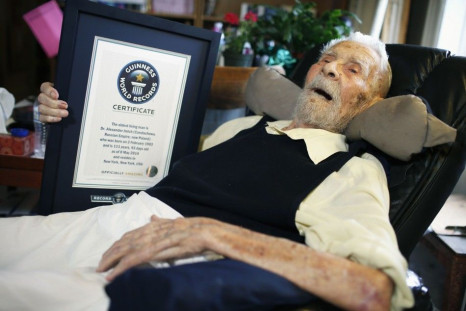 File photo of 111-year-old Alexander Imich holding Guinness World Records certificate recognizing him as world's oldest living man at home in New York City