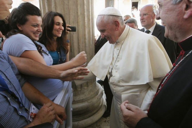 Pope Francis blesses pregnant woman