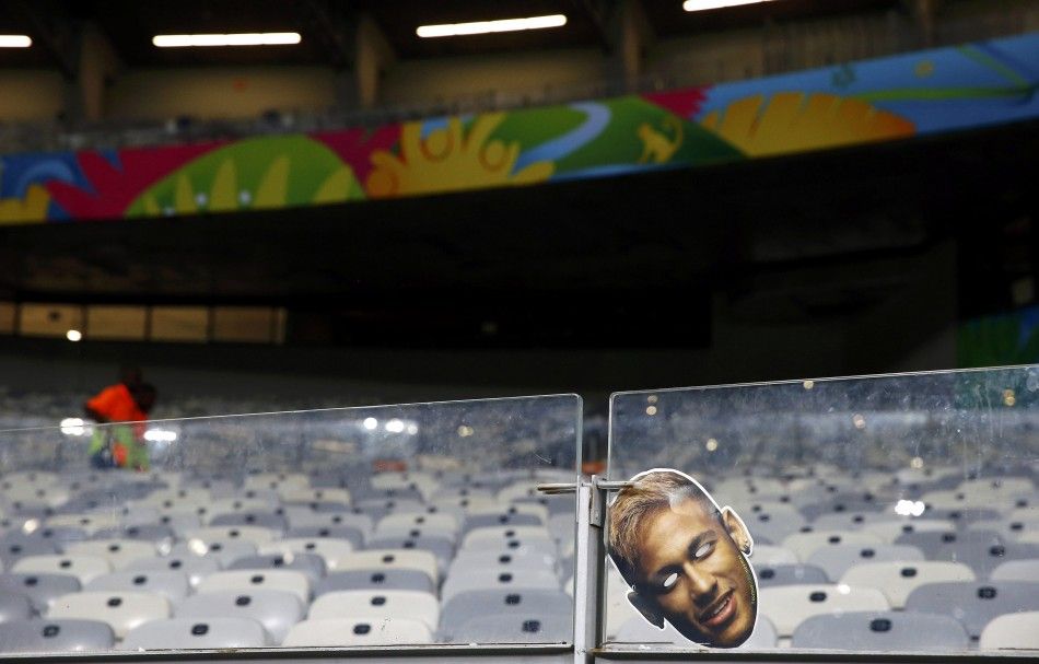 A mask of injured Brazil player Neymar hangs in front of an empty stadium at Mineirao stadium in Belo Horizonte after the Brazil World Cup semi-final soccer match between Brazil and Germany