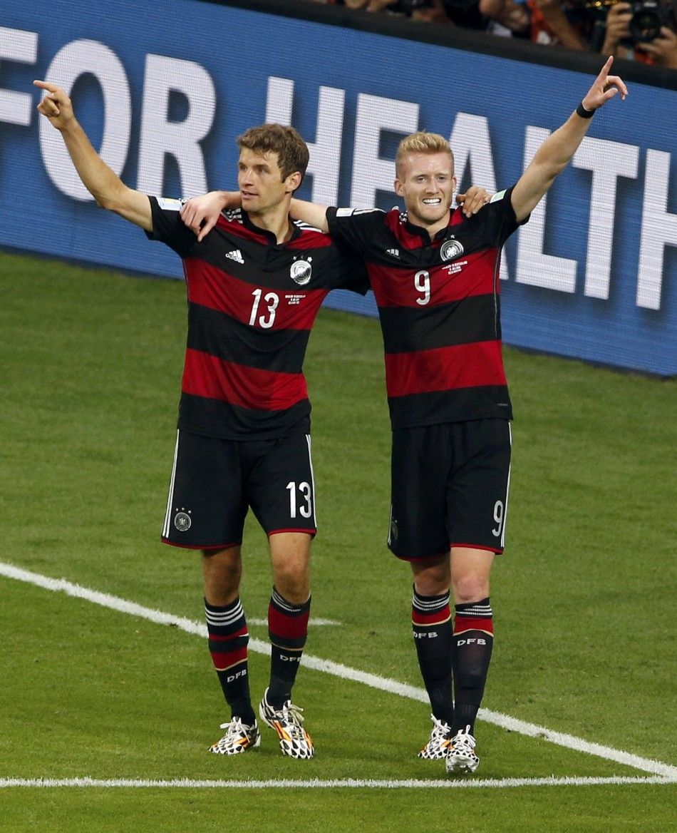 Germanys Andre Schuerrle and Thomas Mueller L celebrate