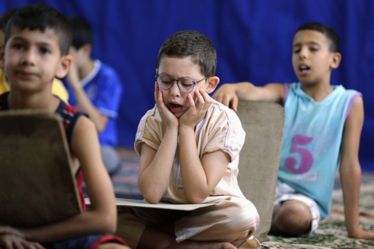 Pupils read and learn the Koran during the holy fasting month of Ramadan