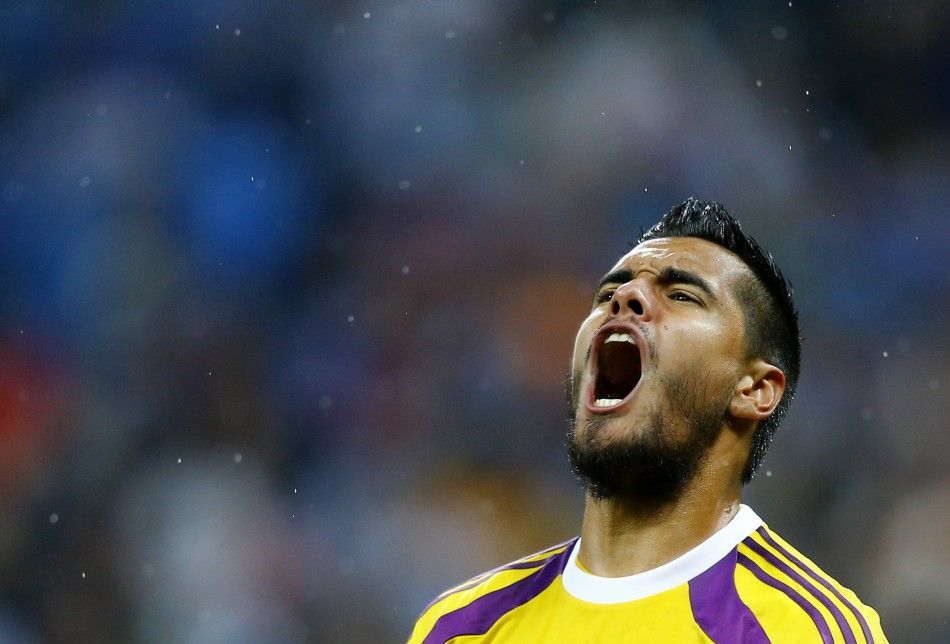 Argentinas goalkeeper Romero reacts after a save on a shot at goal by Vlaar of the Netherlands during a penalty shootout in their 2014 World Cup semi-finals in Sao Paulo
