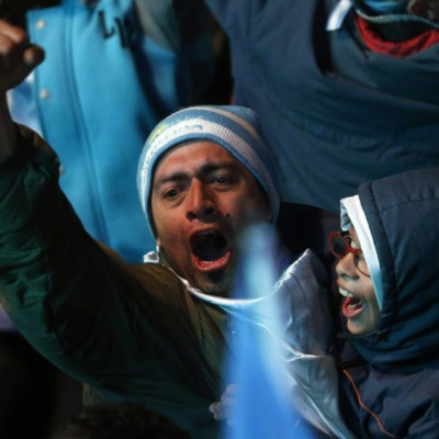 Argentinian fans celebrate at the end of their 2014 World Cup semi-final soccer match against the Netherlands, at a public square in Buenos Aires