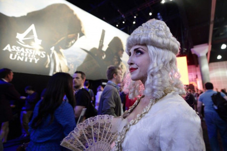 A Woman Dressed As Marie Antoinette From The Video Game 'Assassin's Creed: Unity' Promotes The Game In The Ubisoft Booth At The 2014 Electronic Entertainment Expo, Known As E3, In Los Angeles