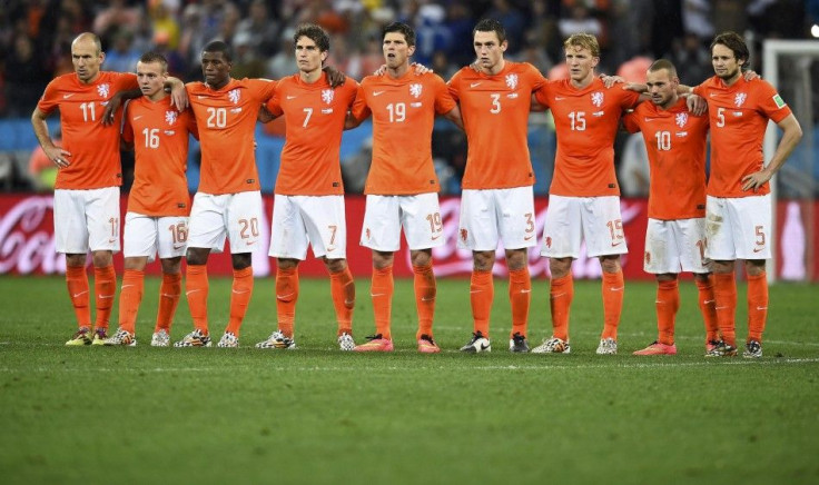 Netherlands&#039; national soccer players react as teammate Vlaar misses an opportunity to score a goal against Argentina during a penalty shoot-out at their 2014 World Cup semi-finals at the Corinthians arena in Sao Paulo