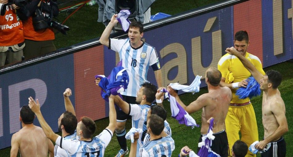 Argentinas Lionel Messi celebrates with teammates