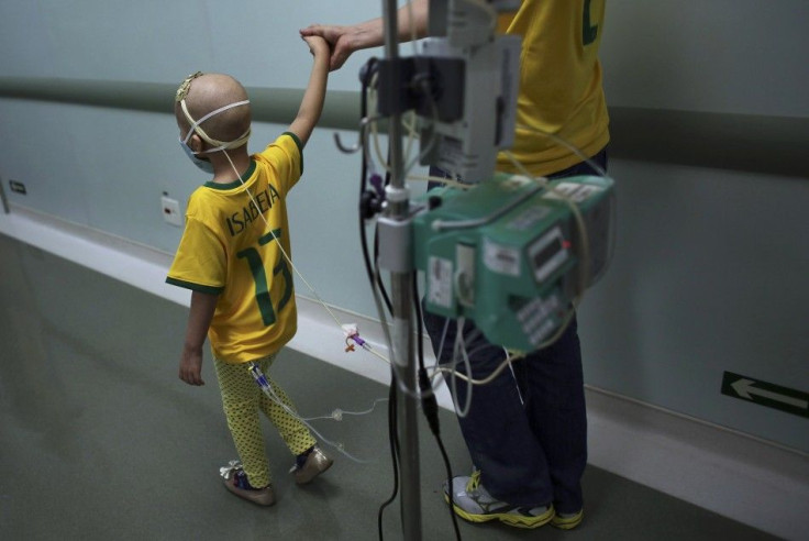 Brazilian patient Isabela, 4, wears a Brazil national soccer team t-shirt with her name on it at the end of the 2014 World Cup Group A soccer match between Brazil and Mexico at the Cancer Itaci Hospital in Sao Paulo