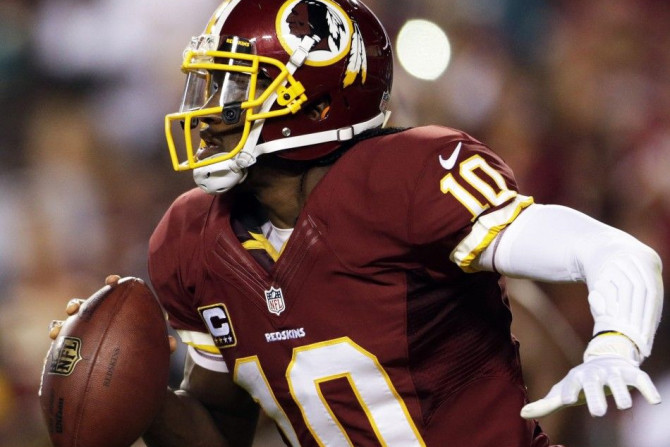 Washington Redskins quarterback Robert Griffin III scrambles against the Philadelphia Eagles&#039; defense during the second half of their NFL football game in Landover, Maryland in this file photo from September 9, 2013.