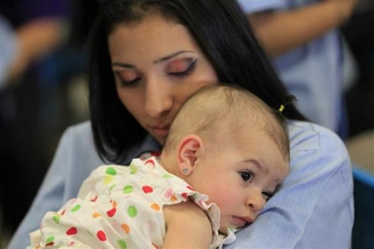 A woman hugs her baby at California Institute for Women state prison in Chino, California May 5, 2012.