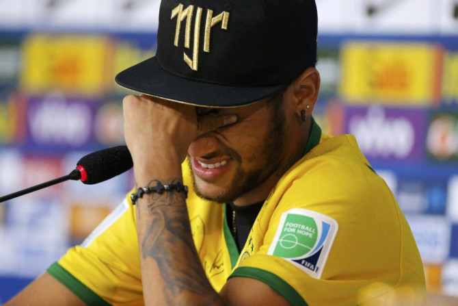 Injured Brazilian national soccer team player Neymar cries during a news conference in Teresopolis