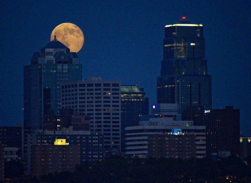 The Supermoon rises over downtown Kansas City, Missouri July 12, 2014. Occurring when a full moon or new moon coincides with the closest approach the moon makes to the Earth, the Supermoon results in a larger-than-usual appearance of the lunar disk. 