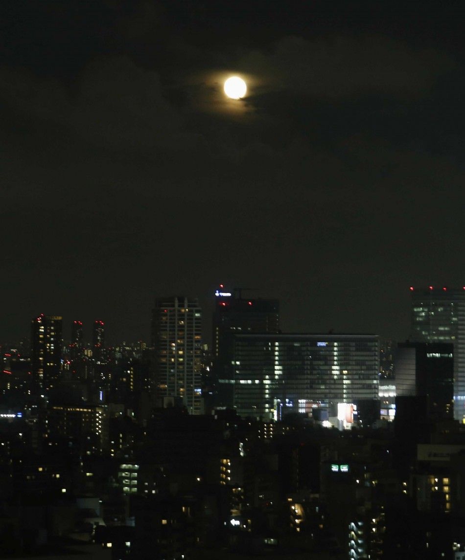 A full moon, known as a quotsupermoonquot, rises over downtown Tokyo July 13, 2014. The astronomical event occurs when the moon is closest to the Earth in its orbit, making it appear much larger and brighter than usual. 