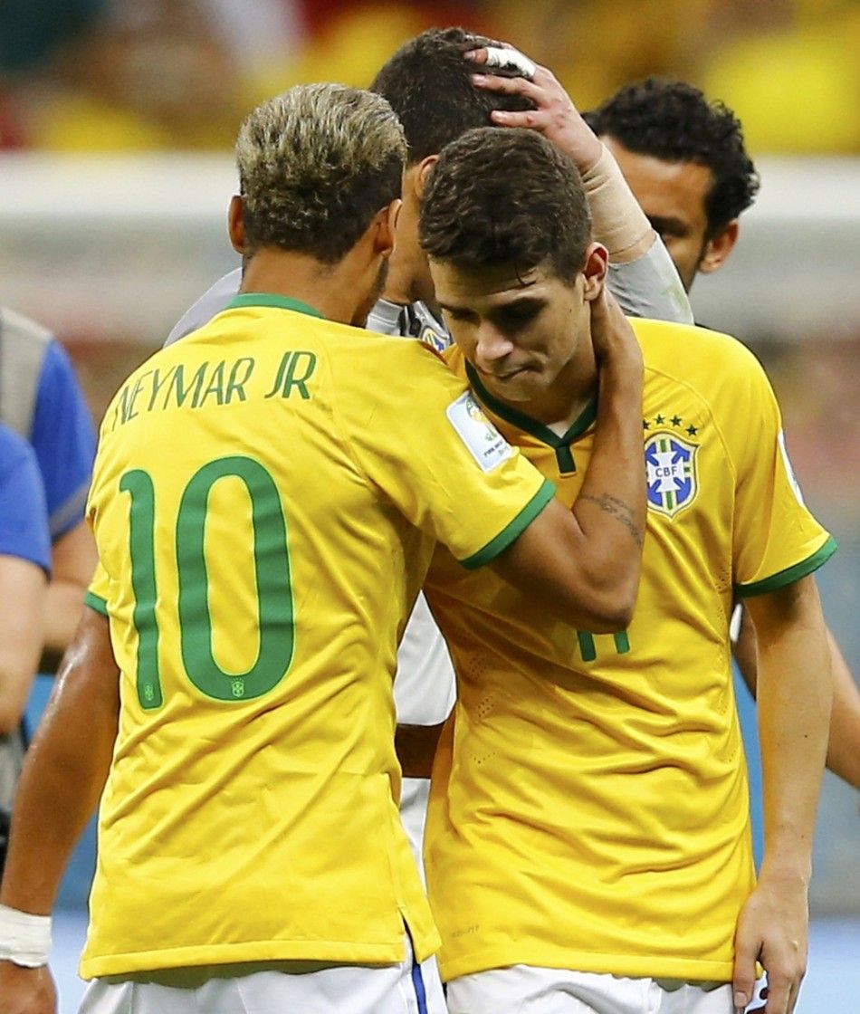 Brazils Neymar L consoles team mate Oscar 