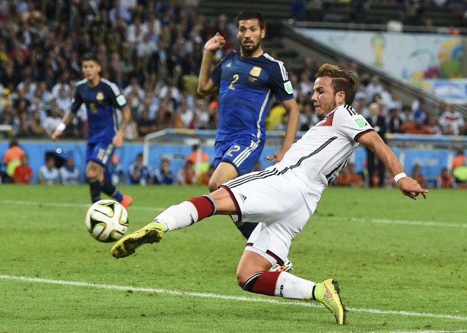 Germanys Mario Goetze shoots to score a goal against Argentina during extra time in their 2014 World Cup final at the Maracana stadium in Rio de Janeiro July 13, 2014. REUTERSDylan Martinez BRAZIL - Tags SPORT SOCCER WORLD CUP TPX IMAGES OF THE DAY  
