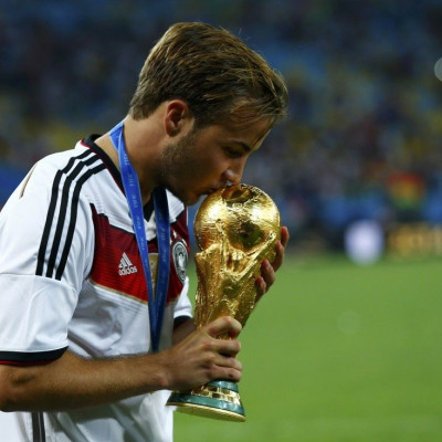 Germany&#039;s Mario Goetze kisses the World Cup trophy after the 2014 World Cup final against Argentina at the Maracana stadium in Rio de Janeiro July 13, 2014.