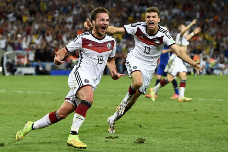 Germany&#039;s Mario Goetze (L) celebrates near teammate Thomas Mueller after scoring a goal during extra time in their 2014 World Cup final against Argentina at the Maracana stadium in Rio de Janeiro July 13, 2014.