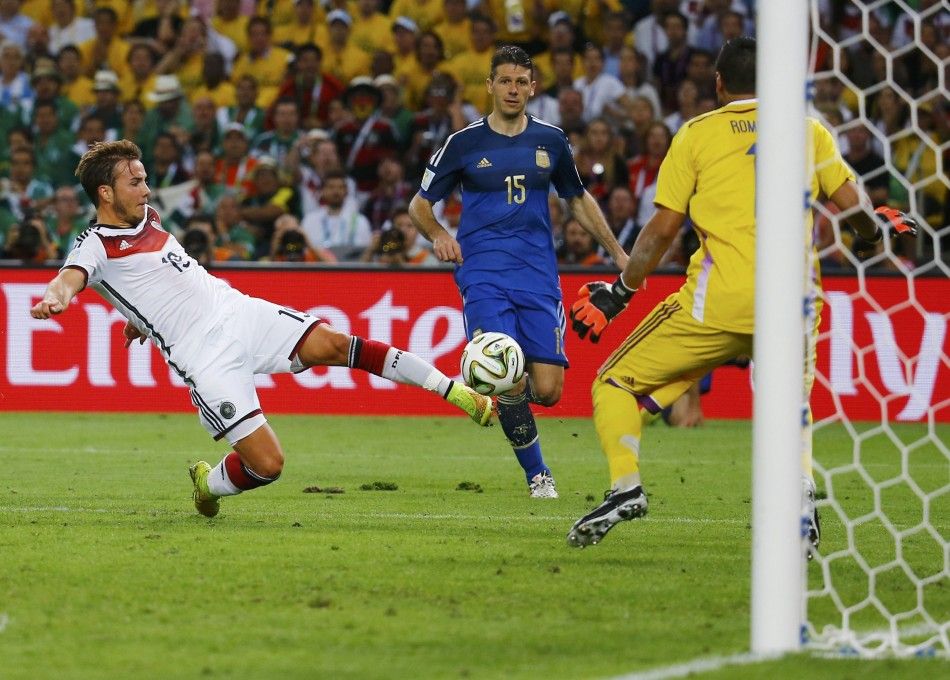 Germanys Mario Goetze shoots to score a goal past Argentinas goalkeeper Sergio Romero during extra time in their 2014 World Cup final at the Maracana stadium in Rio de Janeiro July 13, 2014.
