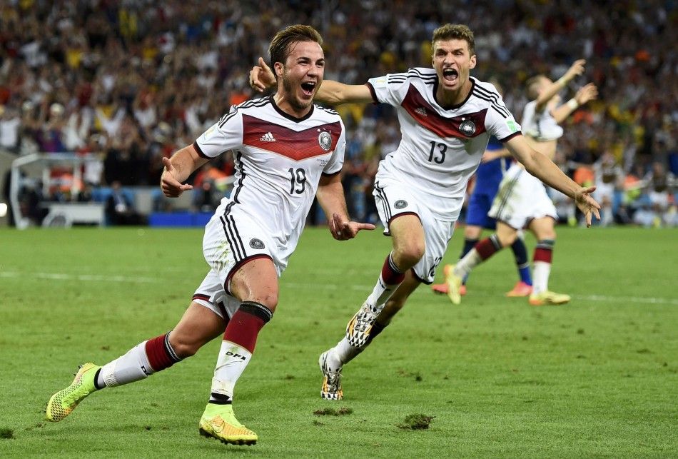 Germanys Mario Goetze L celebrates near teammate Thomas Mueller after scoring a goal during extra time in their 2014 World Cup final against Argentina at the Maracana stadium in Rio de Janeiro July 13, 2014. 
