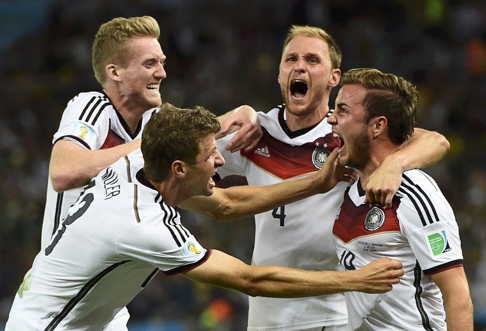 Germanys Mario Goetze celebrates his goal against Argentina with teammates L-R Andre Schuerrle ,Thomas Mueller and Benedikt Hoewedes during extra time in their 2014 World Cup final at the Maracana stadium in Rio de Janeiro July 13, 2014. 