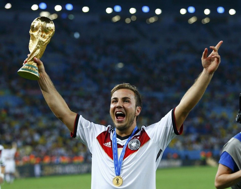 Germanys Mario Goetze lifts the World Cup trophy after the 2014 World Cup final against Argentina at the Maracana stadium in Rio de Janeiro July 13, 2014. 