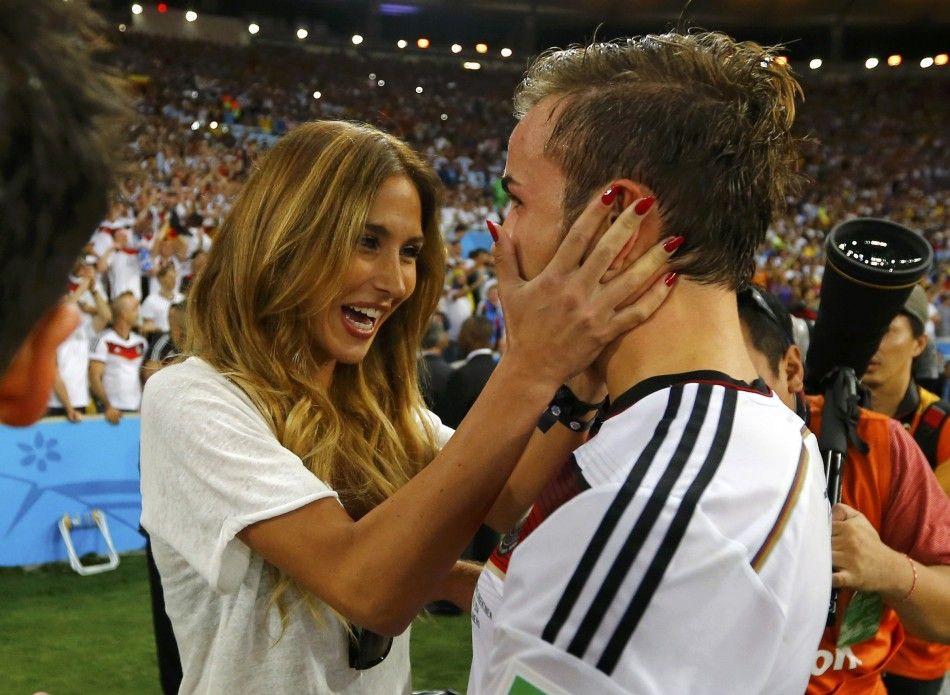 Germanys Mario Goetze hugs his girlfriend Ann-Kathrin Brommel after extra time in the 2014 World Cup final between Germany and Argentina at the Maracana stadium in Rio de Janeiro July 13, 2014. 