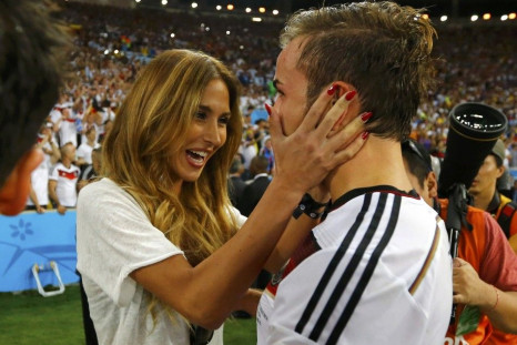 Germany's Mario Goetze hugs his girlfriend Ann-Kathrin Brommel after extra time in the 2014 World Cup final between Germany and Argentina at the Maracana stadium in Rio de Janeiro July 13, 2014. 