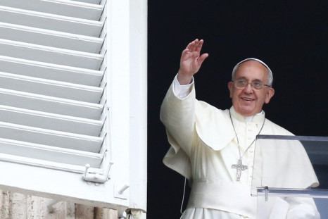 Pope Francis waves as he leads his Sunday Angelus prayer in Saint Peter&#039;s square at the Vatican