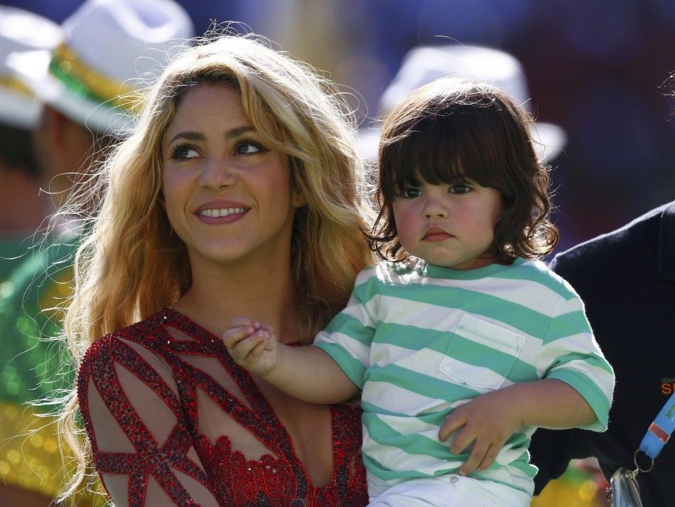 Singer Shakira holds her son Milan during the 2014 World Cup closing ceremony at the Maracana stadium in Rio de Janeiro