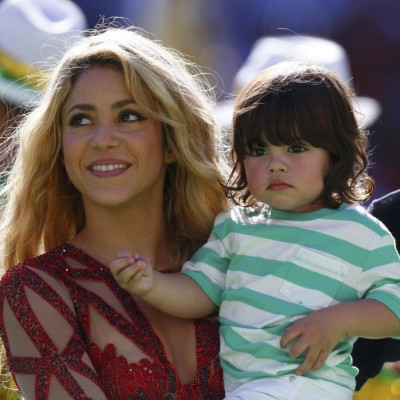 Singer Shakira holds her son Milan during the 2014 World Cup closing ceremony at the Maracana stadium in Rio de Janeiro