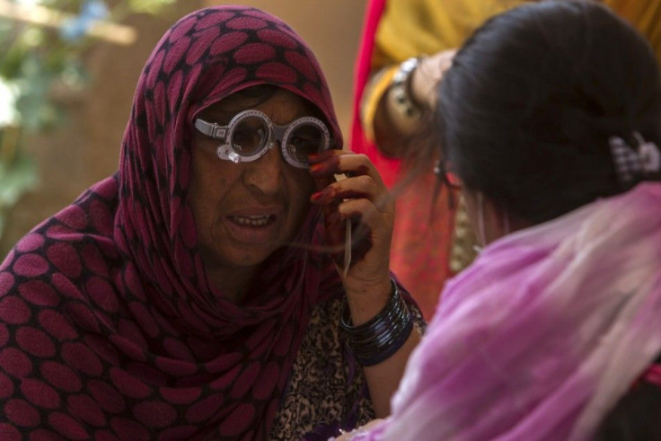 An Afghan Refugee has Her Eyes Tested at a Health Clinic Set Up by the UNHCR to Mark World Refugee Day in Islamabad