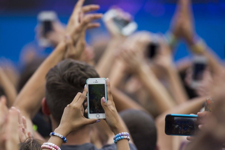 A member of the audience uses an iPhone to record DJ Afrojack's performanceA member of the audience uses an iPhone to record DJ Afrojack's performance on ABC network's Good Morning America program in New York on ABC network's Good Morn