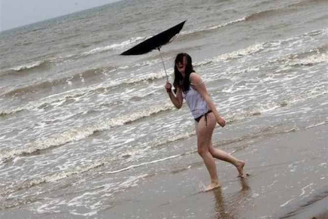 A women&#039;s umbrella is blown inside out on a beach in Skegness, eastern England July 29, 2009.