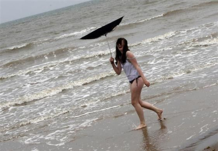 A women&#039;s umbrella is blown inside out on a beach in Skegness, eastern England July 29, 2009.