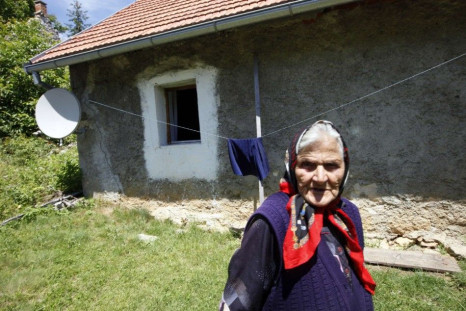 An elderly woman is pictured in the birth village of Gavrilo Princip in Obljaj