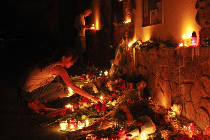 People light candles at the Malaysian embassy to commemorate the victims of Malaysia Airlines MH17, which crashed in eastern Ukraine, in Kiev