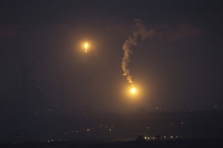 Flares fired by the Israeli military are seen above the northern Gaza Strip, after a five-hour humanitarian truce