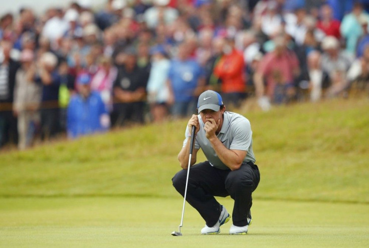 Rory McIlroy of Northern Ireland lines up his putt on the 12th green during the third round of the British Open Championship at the Royal Liverpool Golf Club in Hoylake, northern England July 19, 2014.