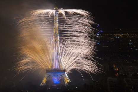 Fireworks light the sky near the Eiffel Tower in a show called &quot;Guerre et Paix&quot;