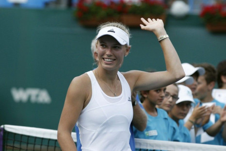 Caroline Wozniacki of Denmark celebrates after her victory against Roberta Vinci of Italy in their Istanbul Cup women&#039;s singles final tennis match, in Istanbul July 20, 2014.