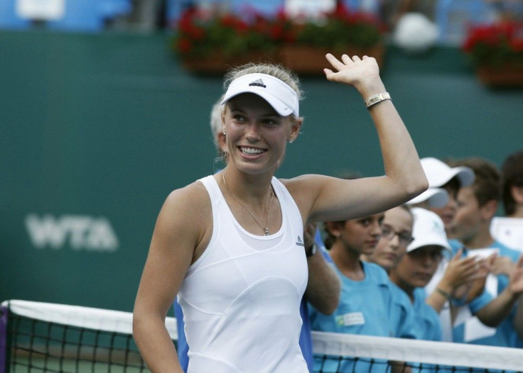 Caroline Wozniacki of Denmark celebrates after her victory against Roberta Vinci of Italy in their Istanbul Cup women&#039;s singles final tennis match, in Istanbul July 20, 2014.