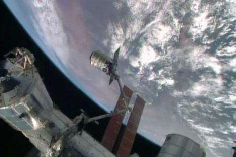 The International Space Station's robotic arm, Canadarm2, grapples the Orbital Sciences' Cygnus cargo craft, as seen in this still image taken from NASA TV July 16, 2014. The Orbital Sciences Corp cargo ship reached the International Space Stati